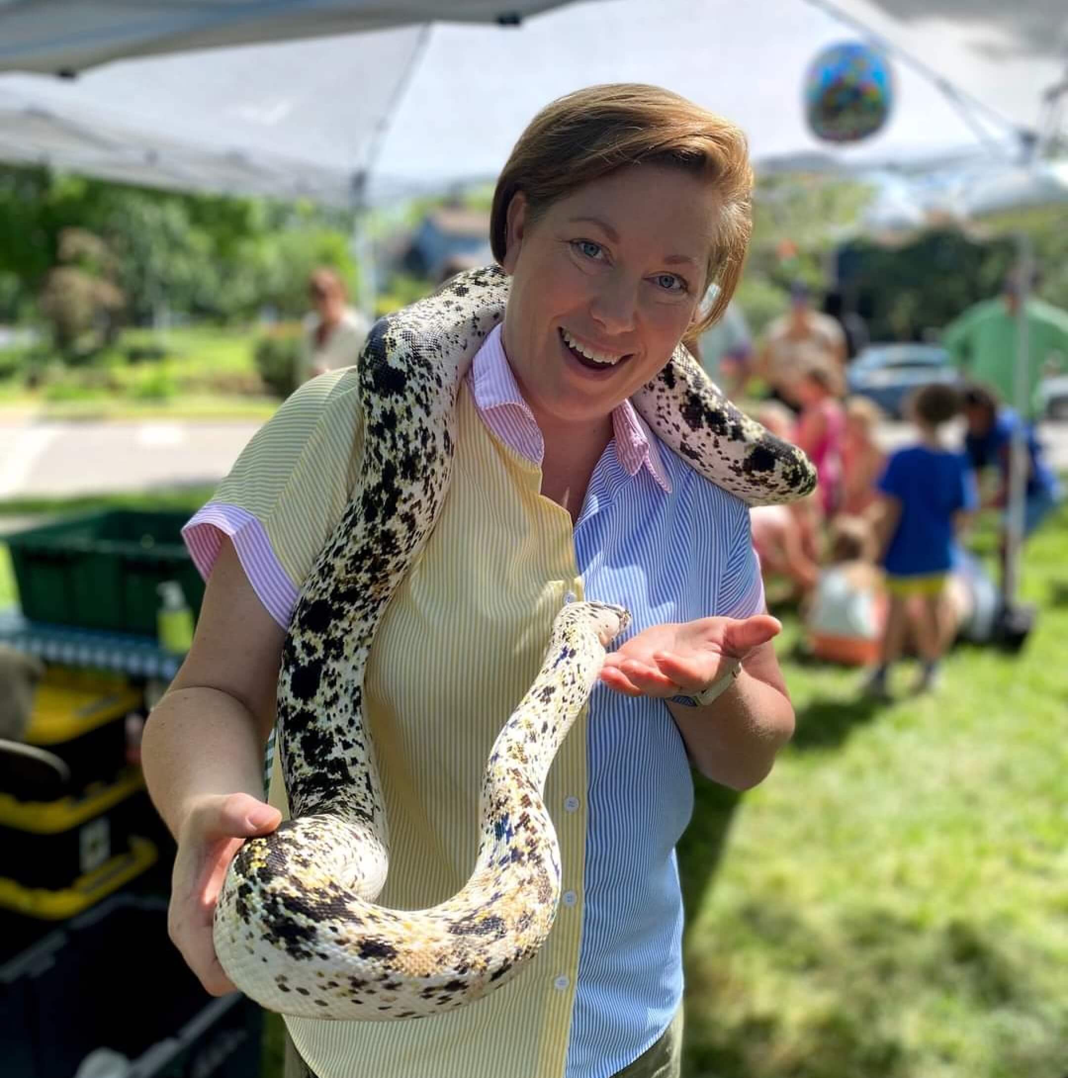 Guests meeting reptiles at a Reptile Adventures party