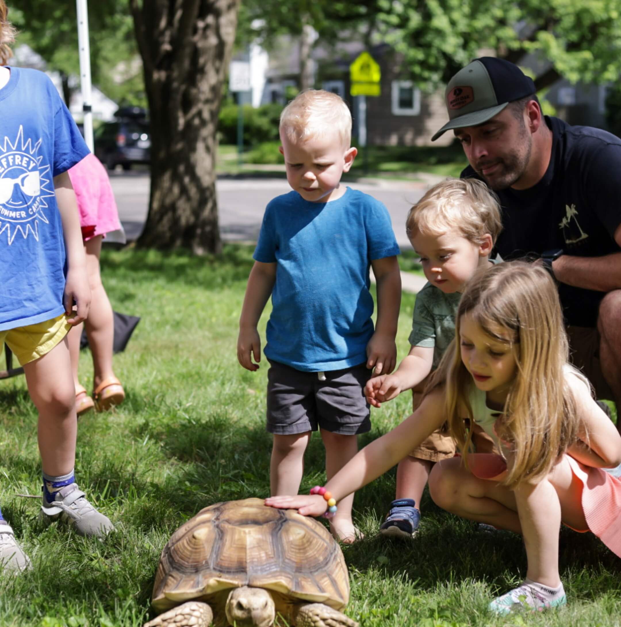 Children learning about lizards during a school program