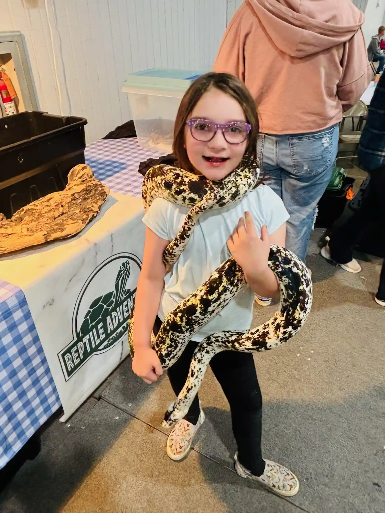 Alabama guests interacting with snakes and lizards